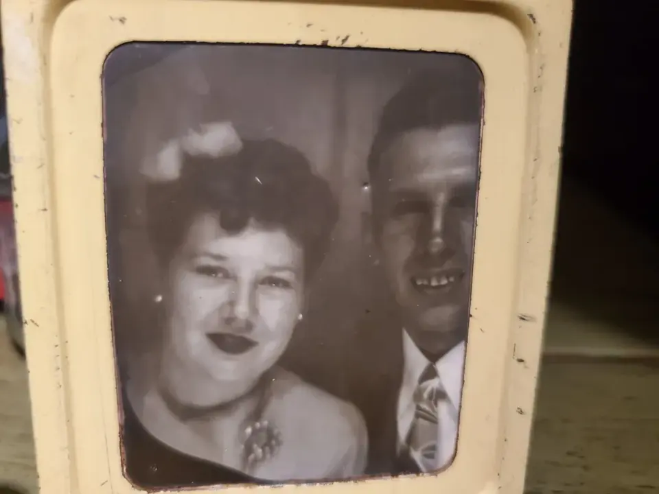 Framed archival portrait of the family’s mom and dad